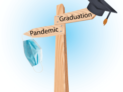 A pole with a graduation cap on the graduation crossroad and a mask on the pandemic crossroad