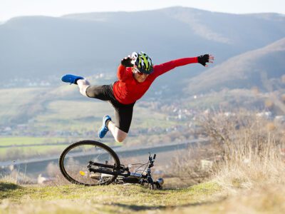 Man falling forward off his bike