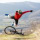 Man falling forward off his bike